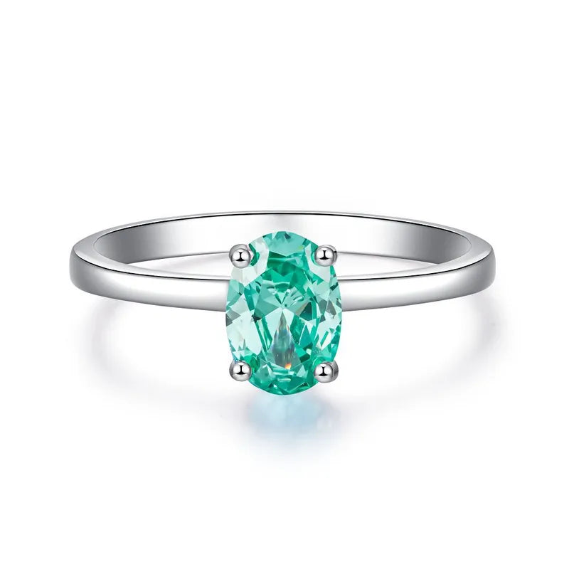 Bague solitaire pierre ovale turquoise argent 925 élégante - vue latérale
